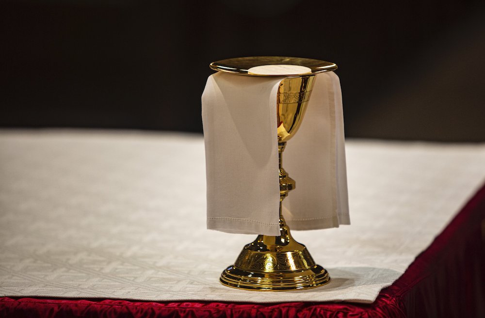 The Eucharist rests upon a paten on an altar in a cathedral. (CNS/Chaz Muth) The Eucharist rests upon a paten on an altar in a cathedral. (CNS/Chaz Muth)
